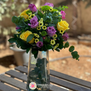 Yellow purple vase arrangement