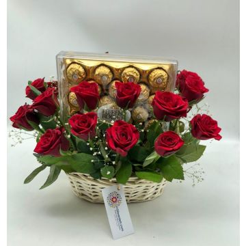 Red roses in a basket with ferrero