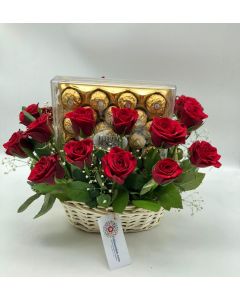Red roses in a basket with ferrero