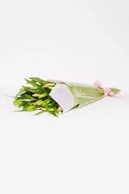 Preparing lilium flowers by trimming stems and removing leaves